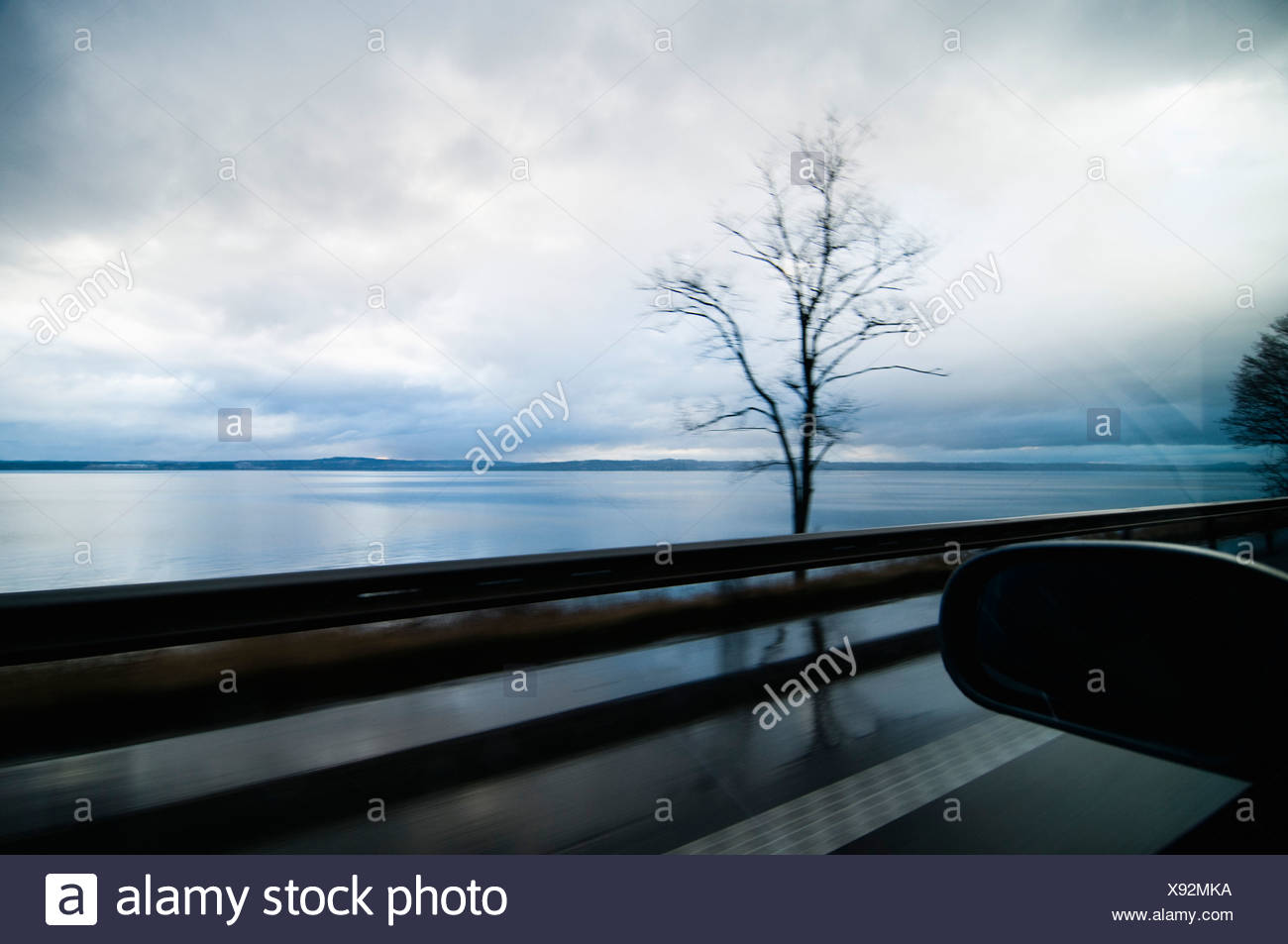 View over lake from car window Stock Photo