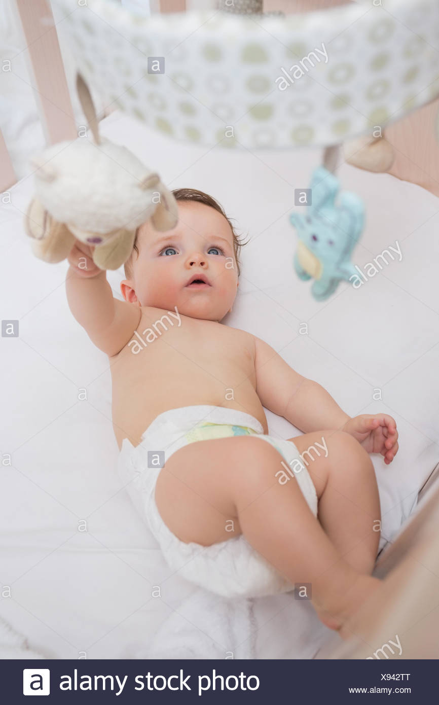 Adorable Baby Playing With Toys In Crib Stock Photo 280987864 Alamy