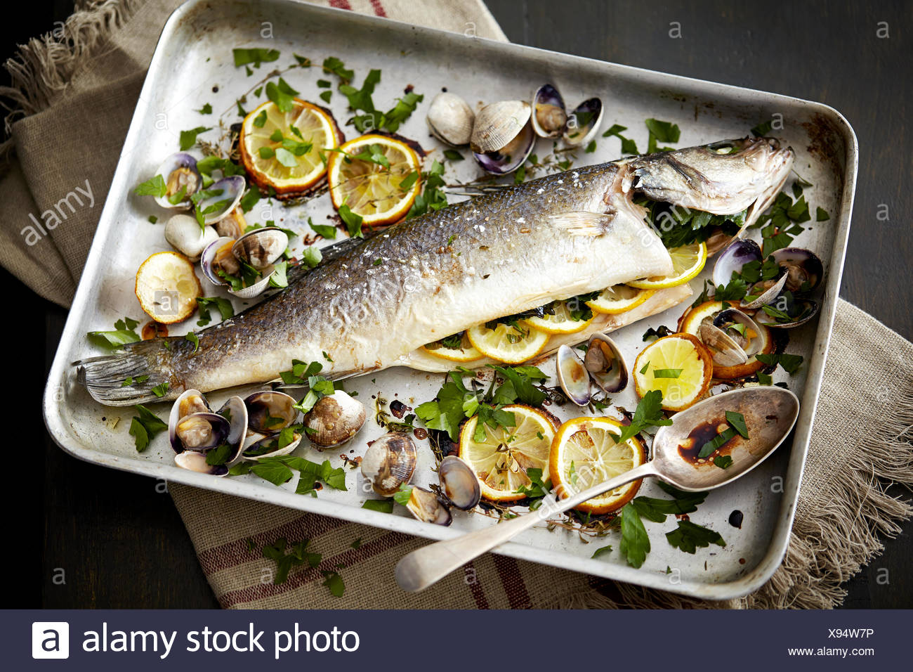 Baking tray with baked fish stuffed 