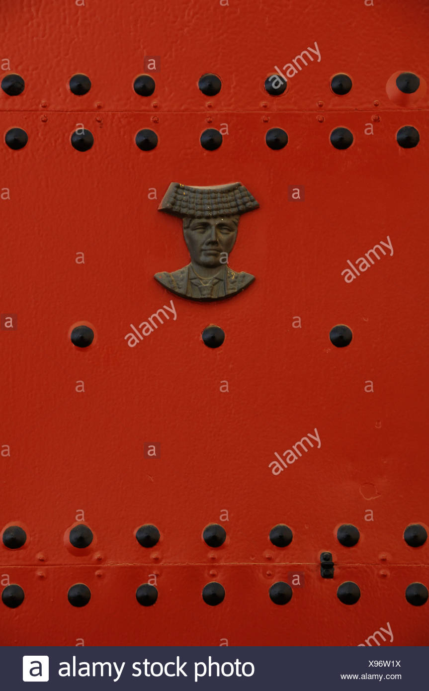 Head of a matador mounted on a red door, Real Maestranza de Sevilla bullring, Seville, Andalusia, Spain Stock Photo