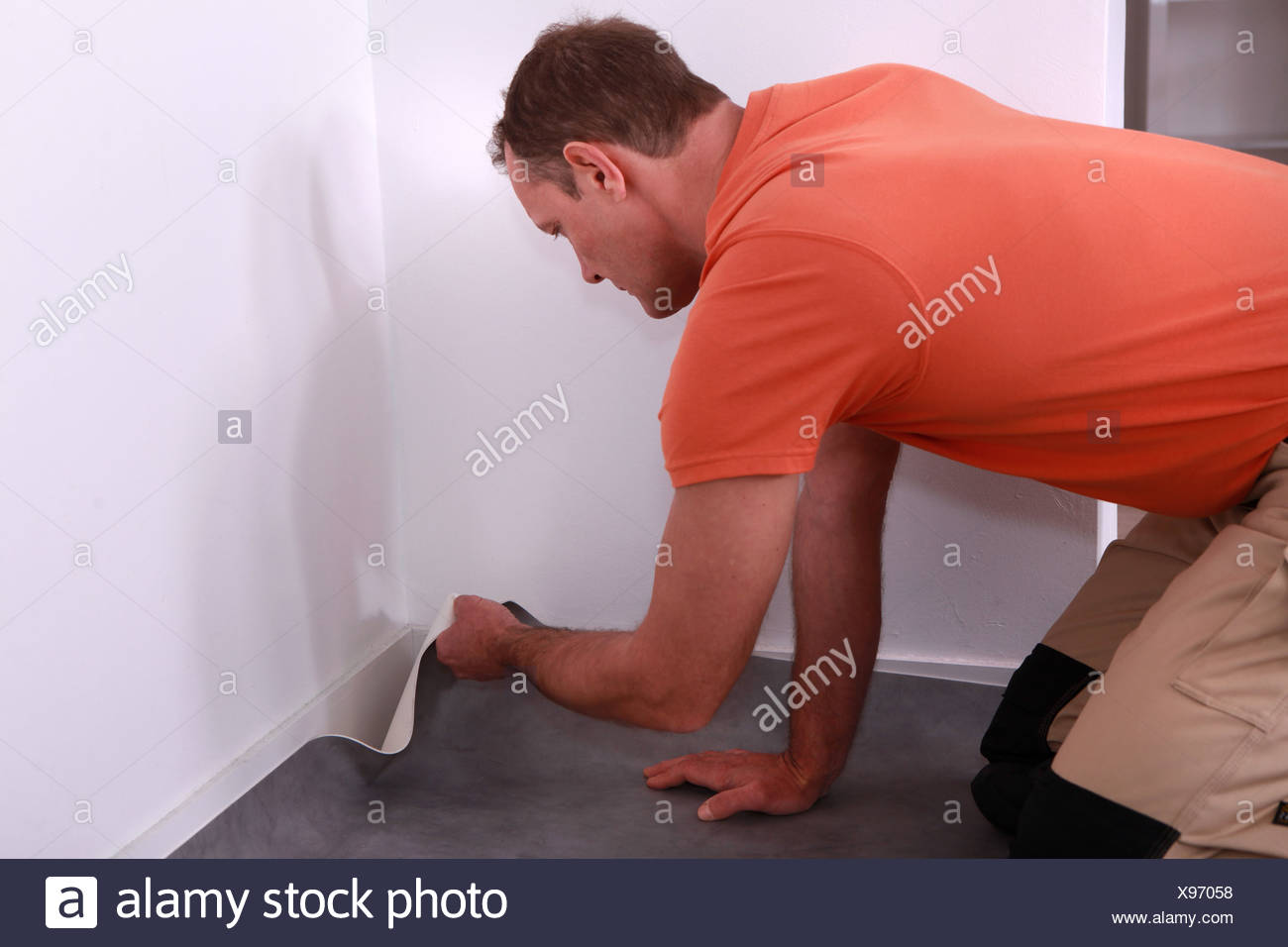 Workman Putting Down Linoleum Flooring Stock Photo 281051604 Alamy