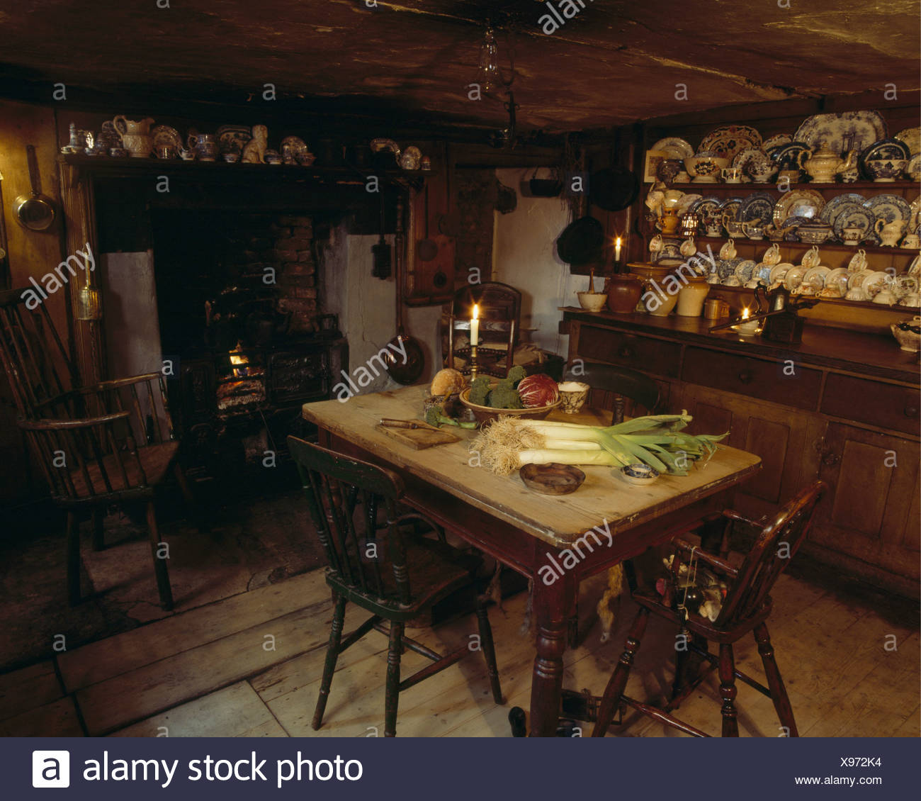 Victorian Cottage Kitchen With Small Wooden Table And Dresser