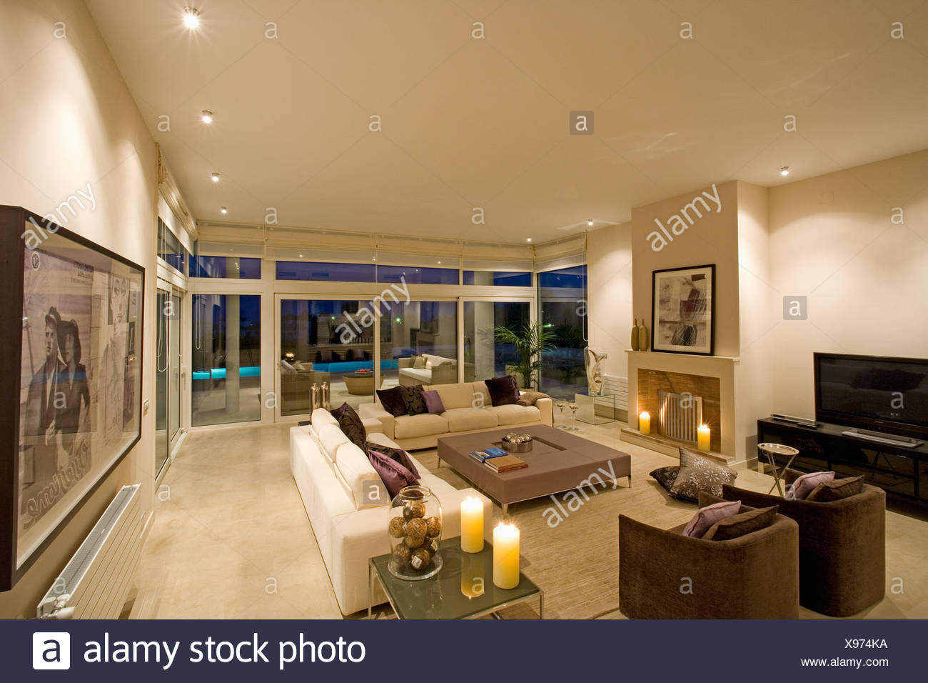 Brown Armchairs And Cream Sofas In Modern Spanish Living