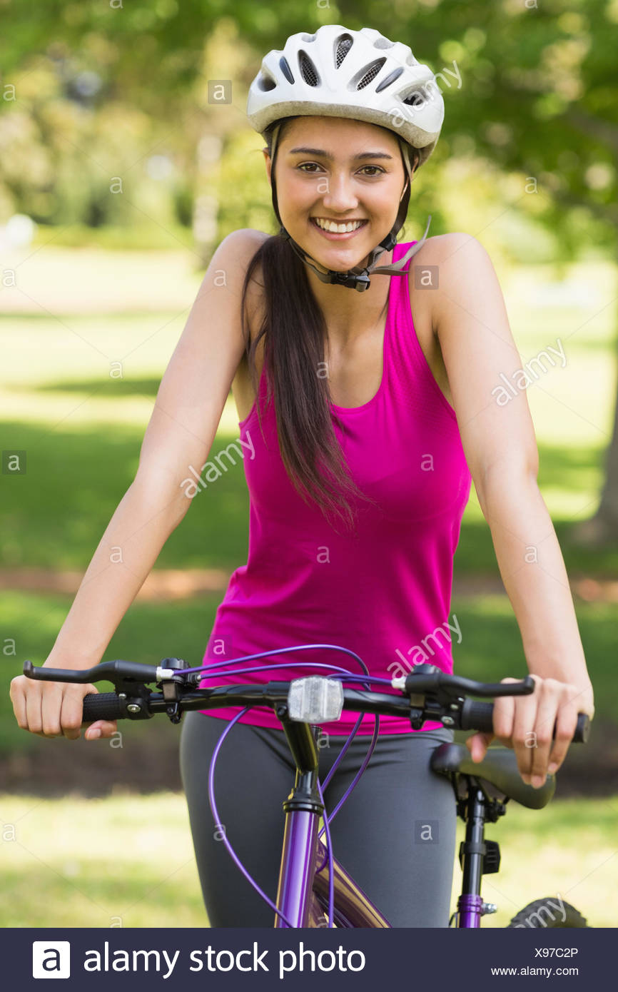 Fit Young Woman With Helmet Riding Bicycle Stock Photo Alamy