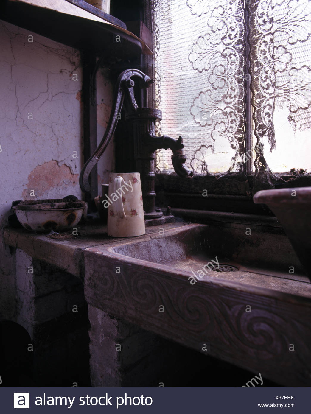 Iron Water Pump And Victorian Earthenware Sink Stock Photo