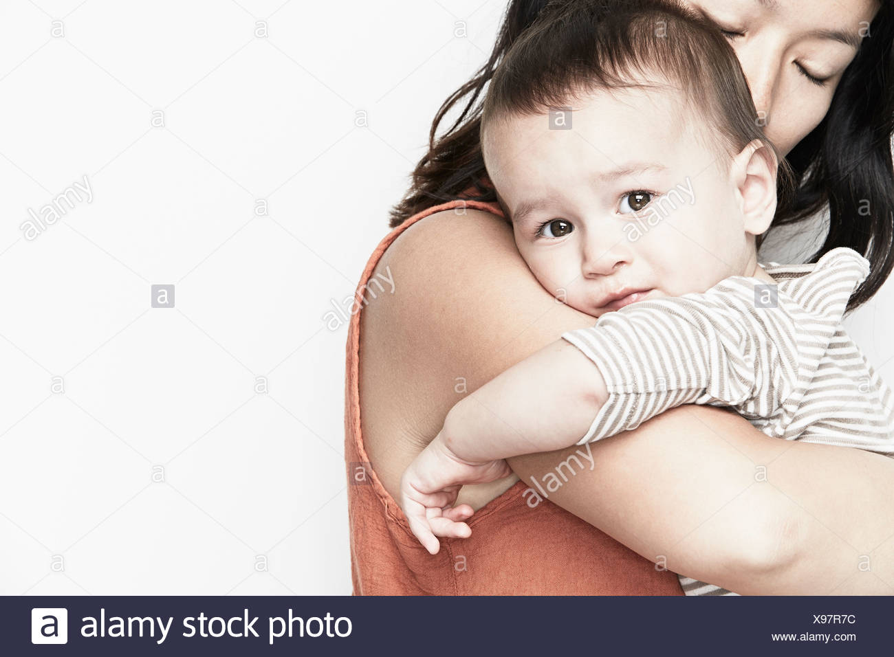 mom hugging baby