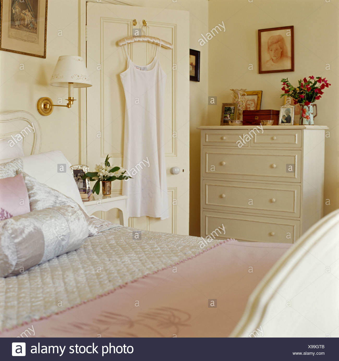 Nightgown Hanging On Back Of Door In Cream Bedroom With Cream