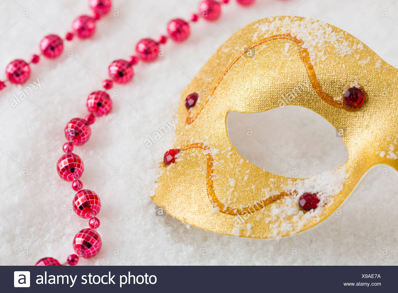 Download Golden Mask And Red Necklace On Snow Stock Photo Alamy PSD Mockup Templates