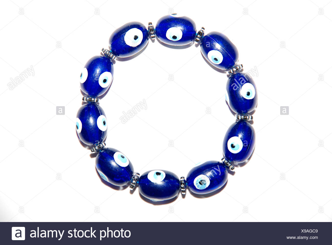 A bracelet with magic eyes used to ward off the evil eye and spirits on  white background Stock Photo - Alamy