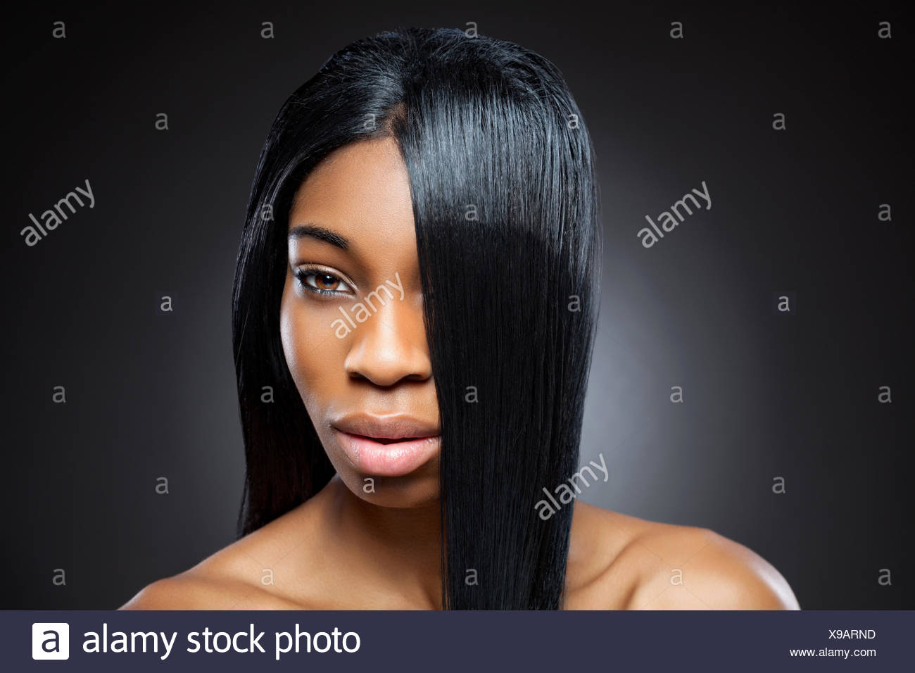 Beautiful Young Black Woman With Straight Shiny Hair Stock Photo