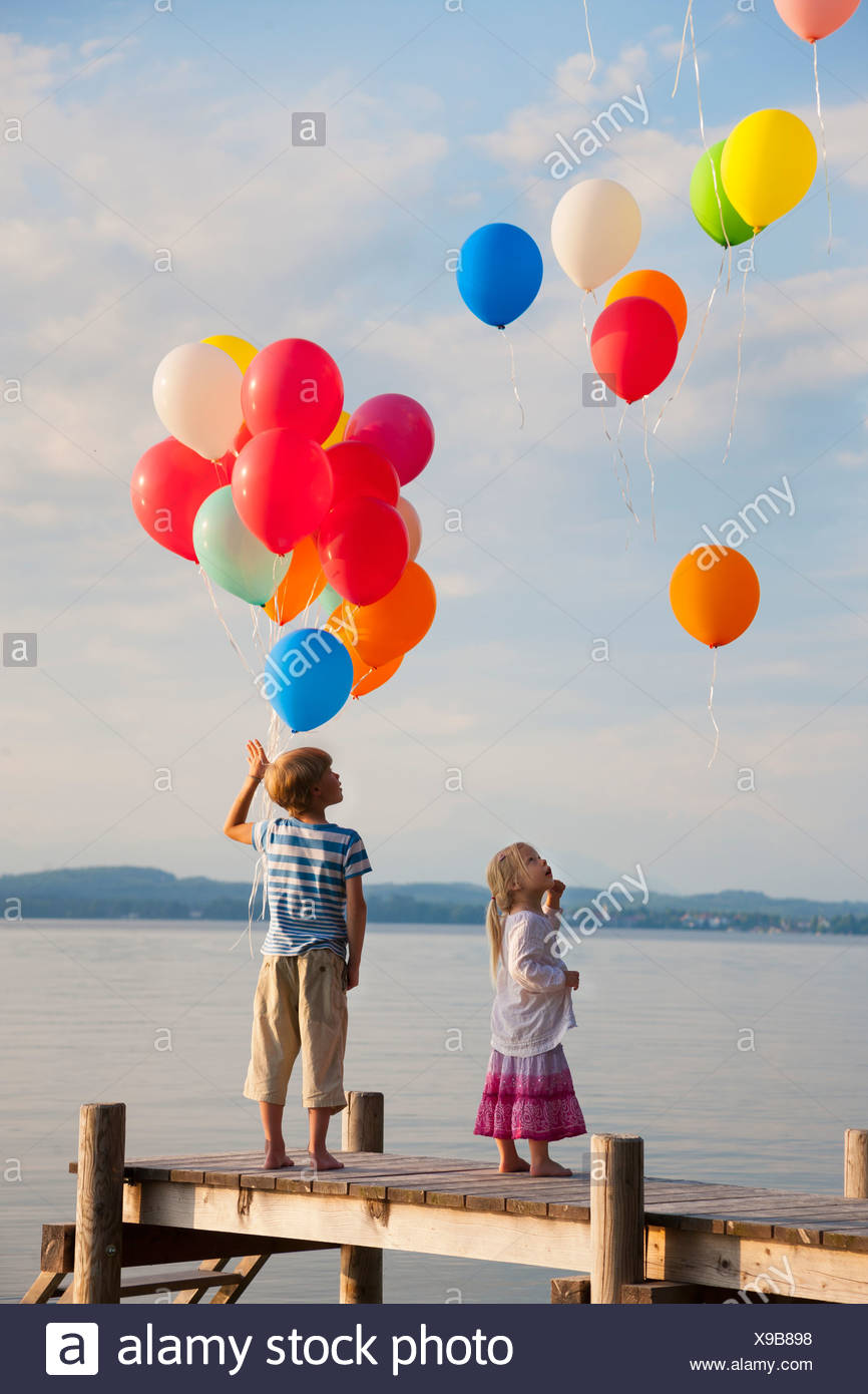Image result for boy flying balloons  image sea shore