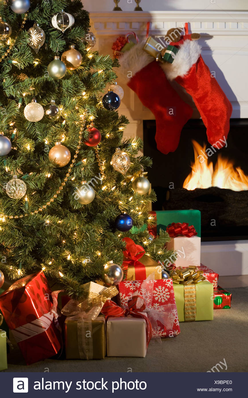 Christmas Tree With Presents And Fireplace With Stockings Stock