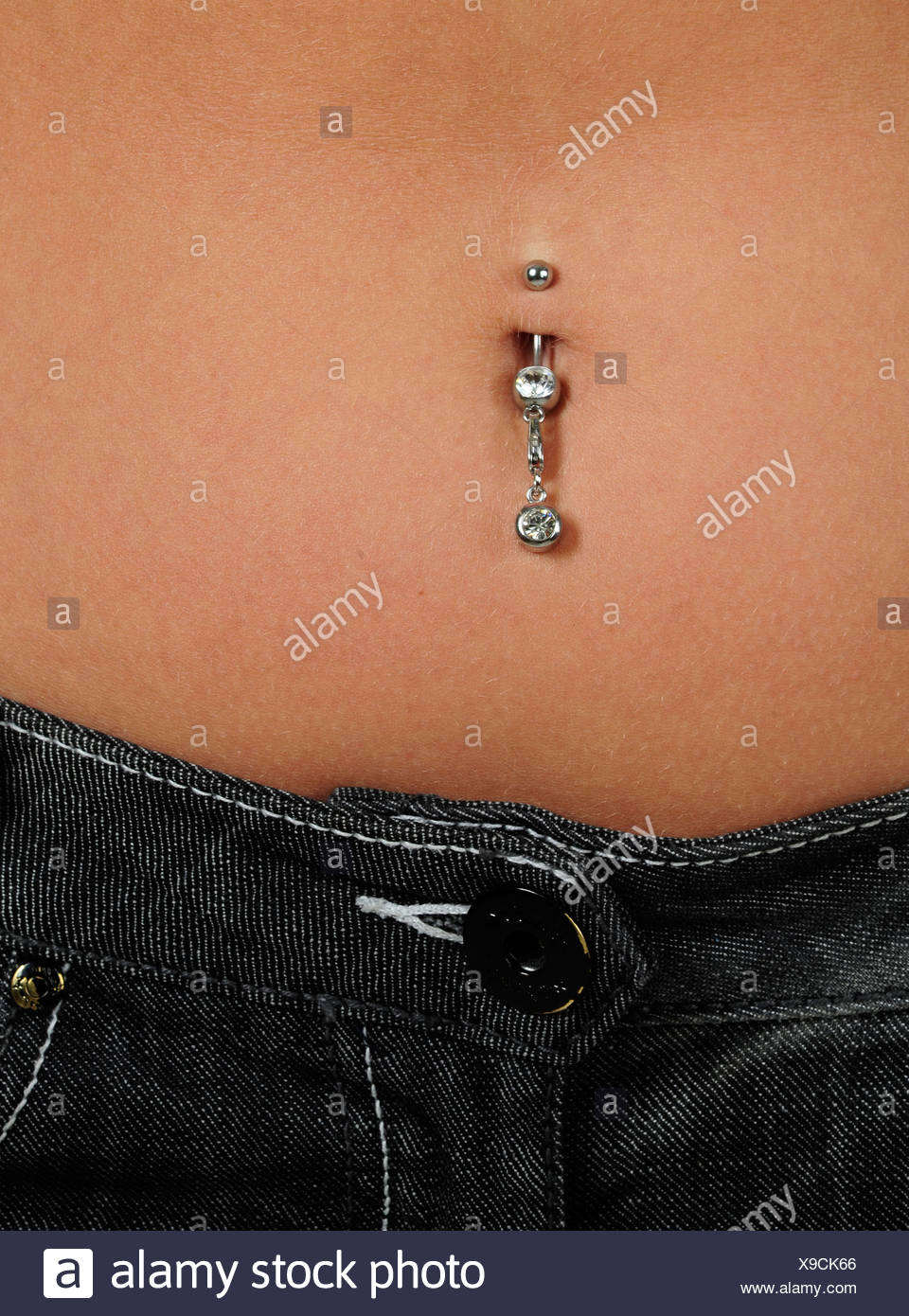 Girl Belly Button Piercing High Resolution Stock Photography and Images