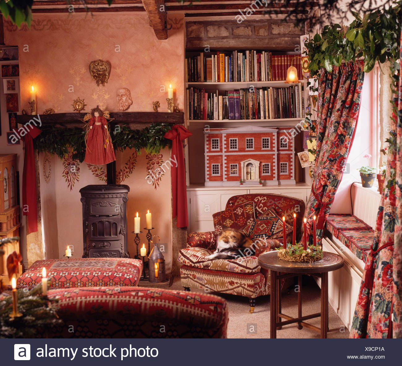 Lighted Candles Fireplace With Wood Burning Stove In Cottage