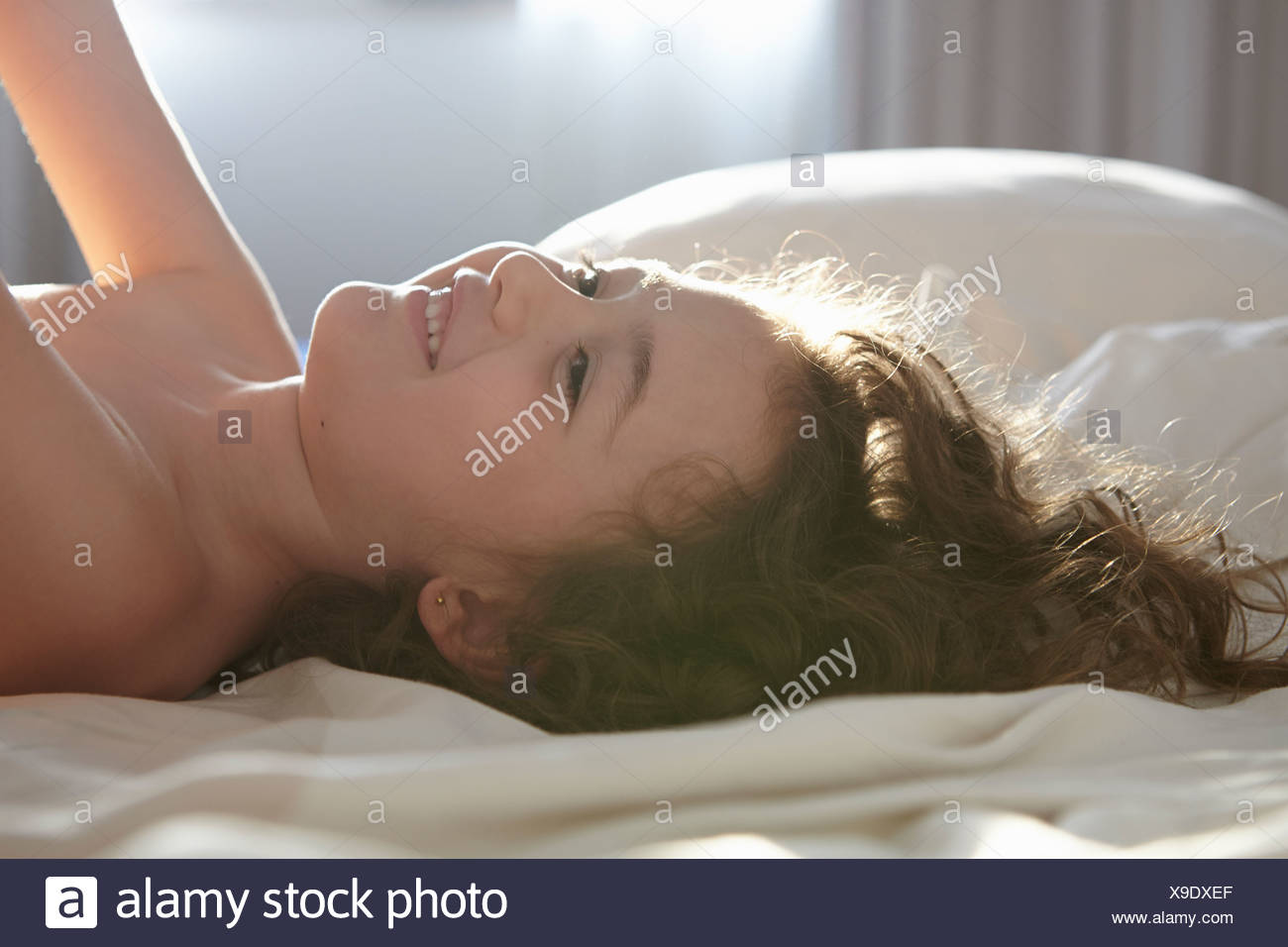 Girls Lying On Bed High Resolution Stock Photography and Images Alamy