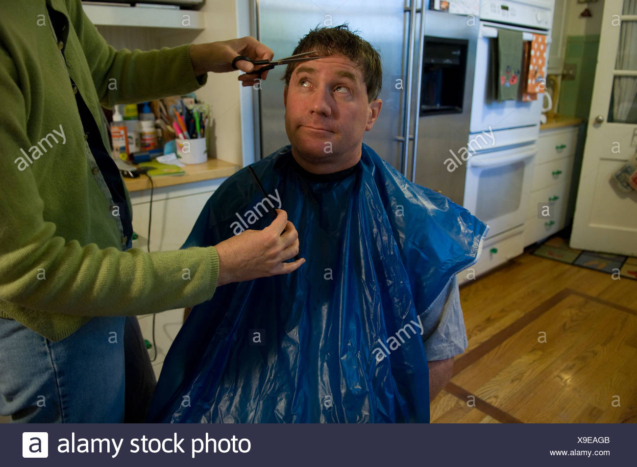 A Man Gets His Hair Cut At His Home In Lincoln Ne Stock Photo