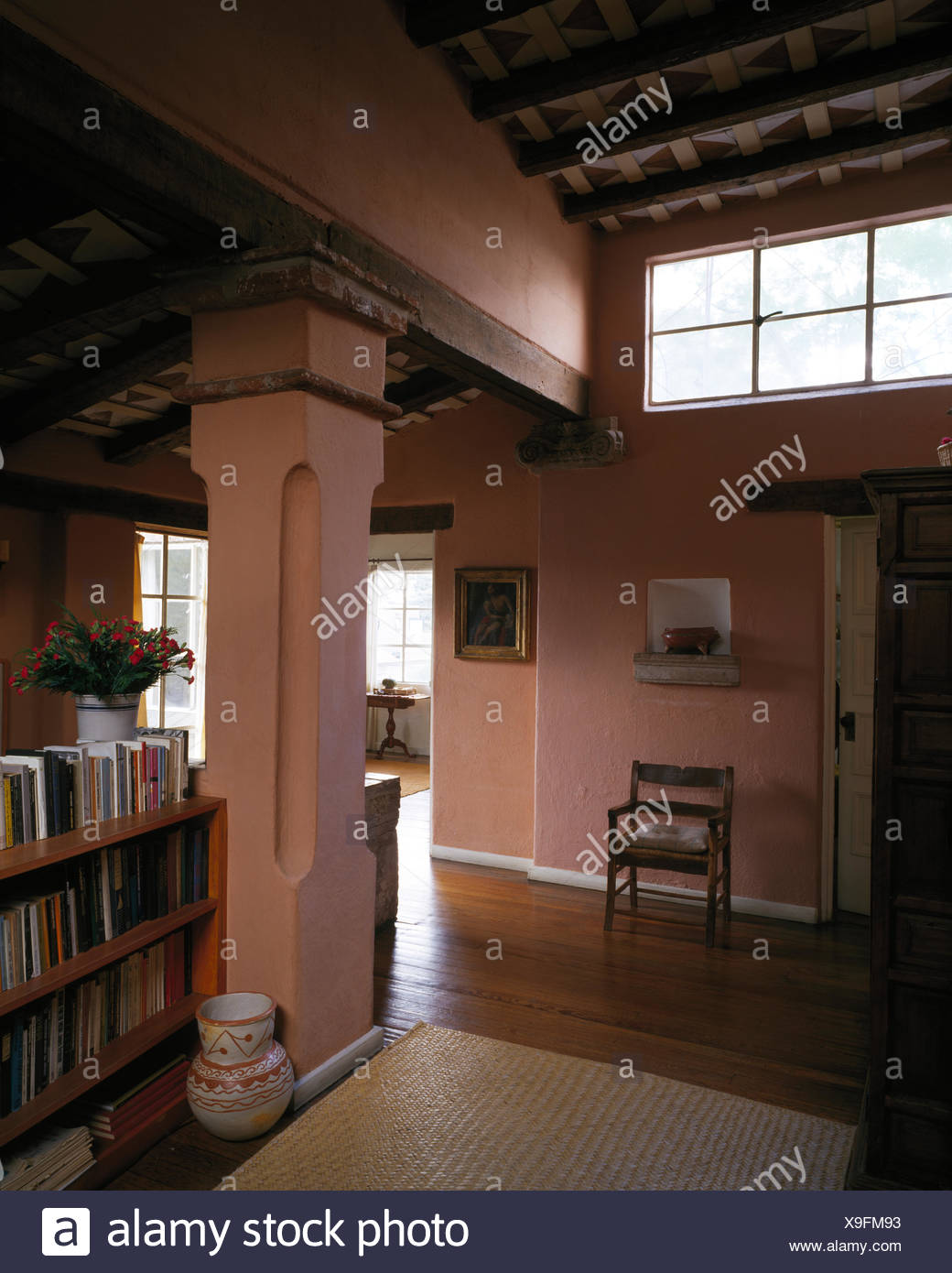 Pink Washed Walls In Hallway In Open Plan Mexican House Stock