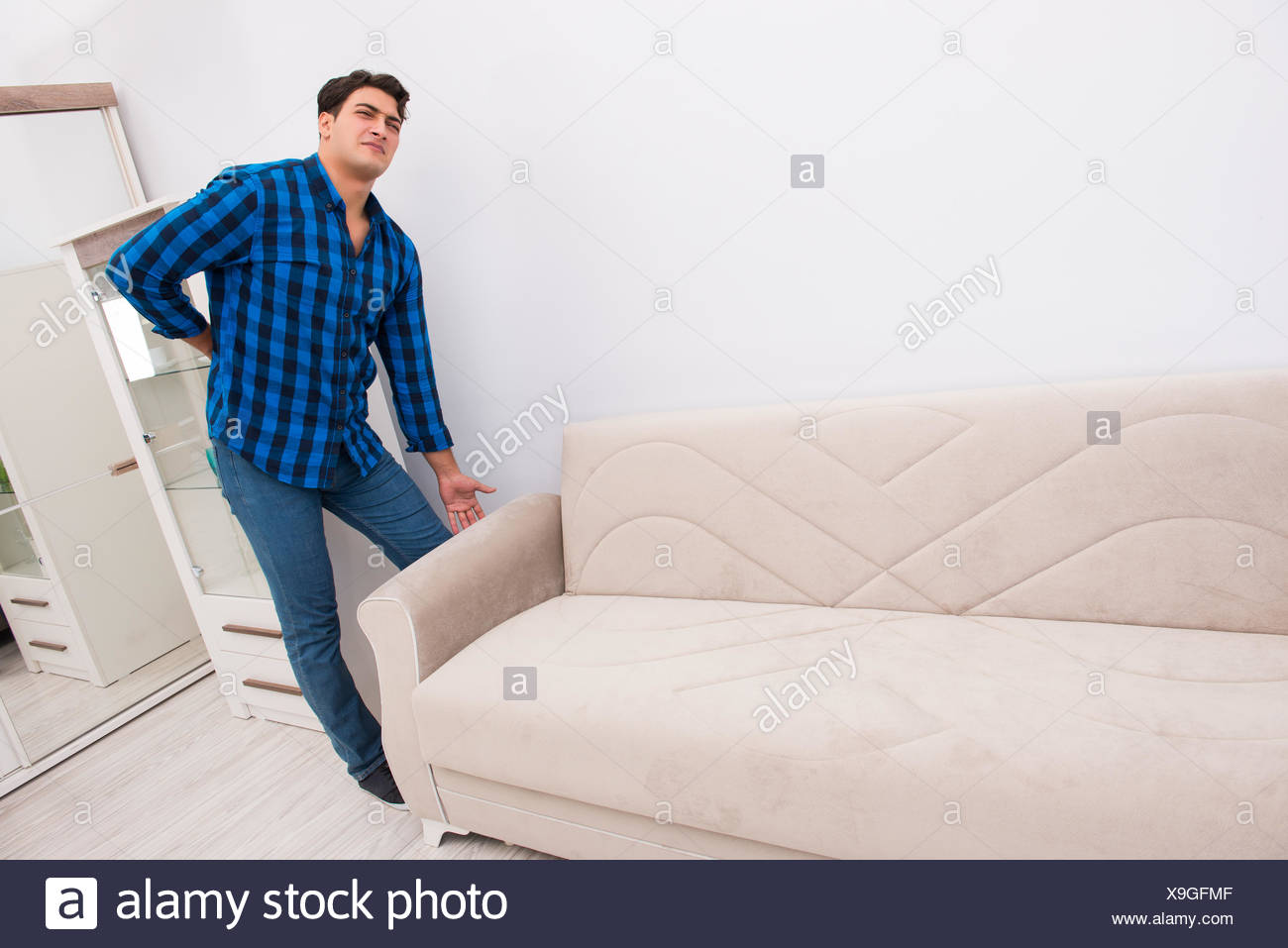 Young Man Moving Sofa Couch Stock Photo 281261359 Alamy