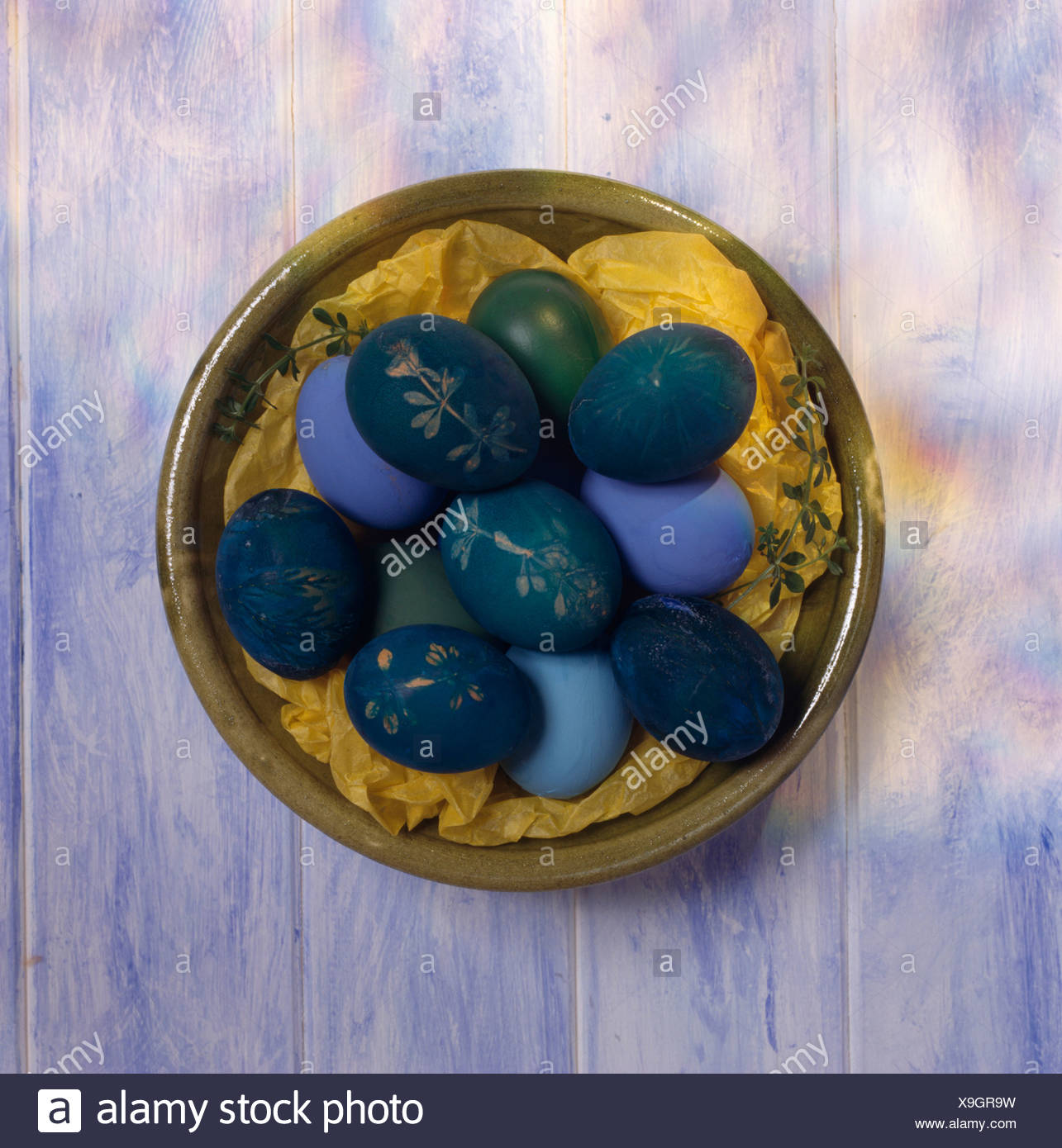 Close Up Of Bowl Of Blown Eggs Painted Blue And Decorated For