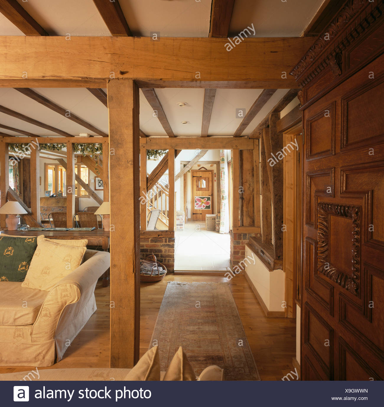 Large Wooden Support And Ceiling Beams In Living Room In Barn