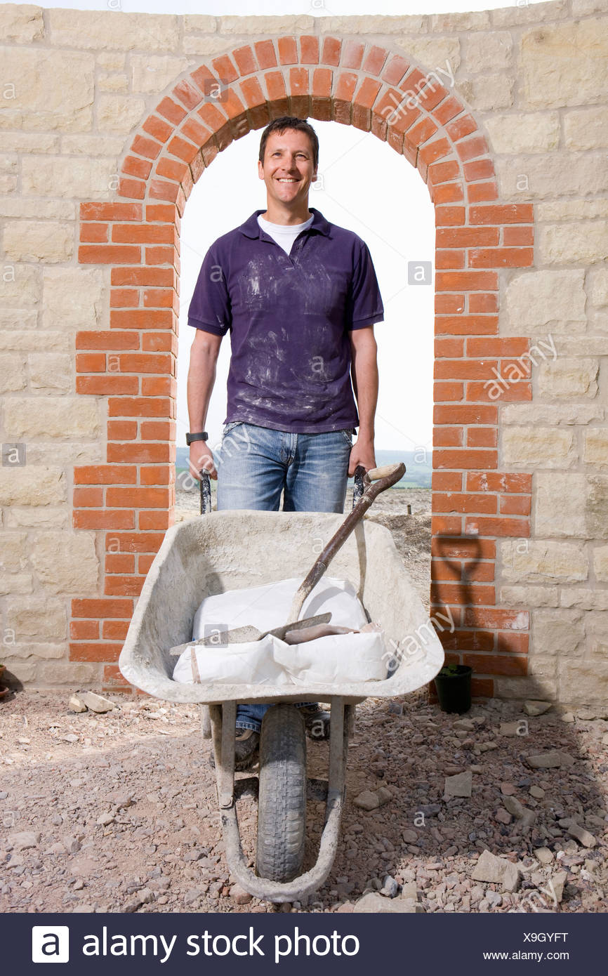 Man With Wheelbarrow Stock Photos & Man With Wheelbarrow Stock Images