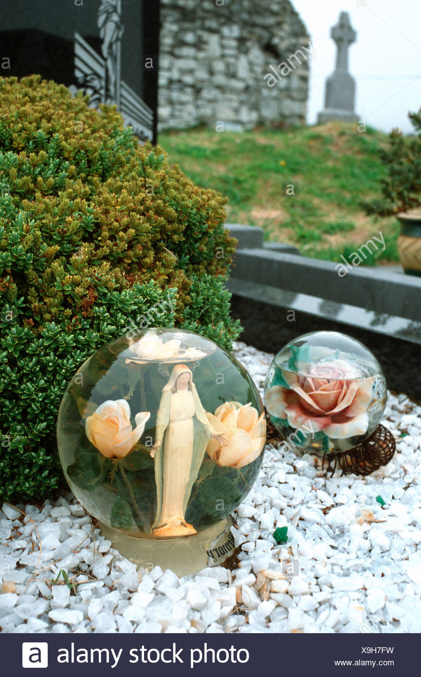 Ireland Grave Decorations Madonna In A Glass Ball Stock Photo