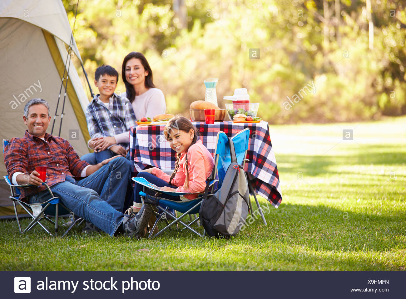 Family Enjoying Camping Holiday In Countryside Stock Photo Alamy