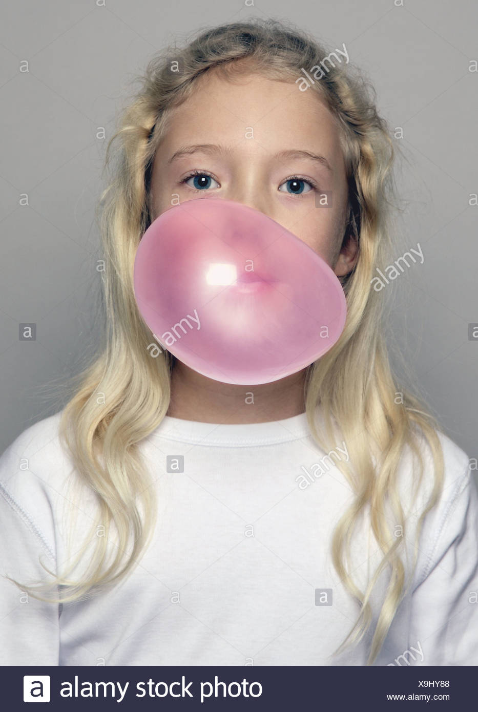 Girl Blowing Chewing Gum Bubble High Resolution Stock Photography and