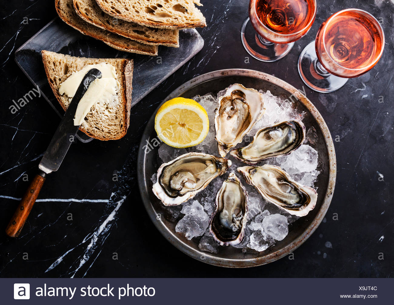 Opened Oysters On Metal Plate Bread With Butter And Rose Wine On Dark Marble Background Stock Photo Alamy Opened Oysters On Metal Plate Bread With Butter And Rose Wine On Dark Marble Background Stock Photo Alamy