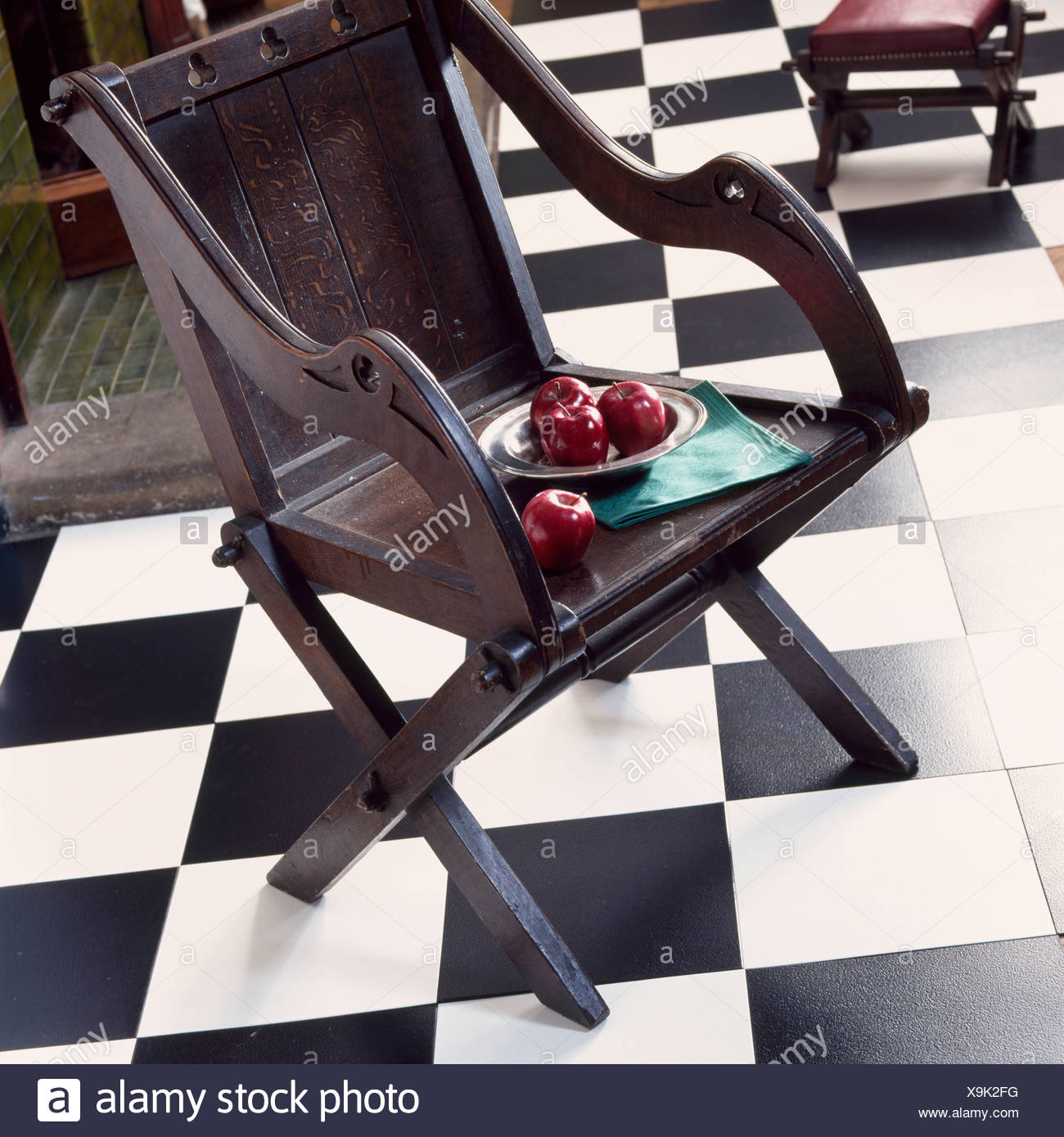 Plate Of Red Apples On Dark Wood Chair On Black White Vinyl