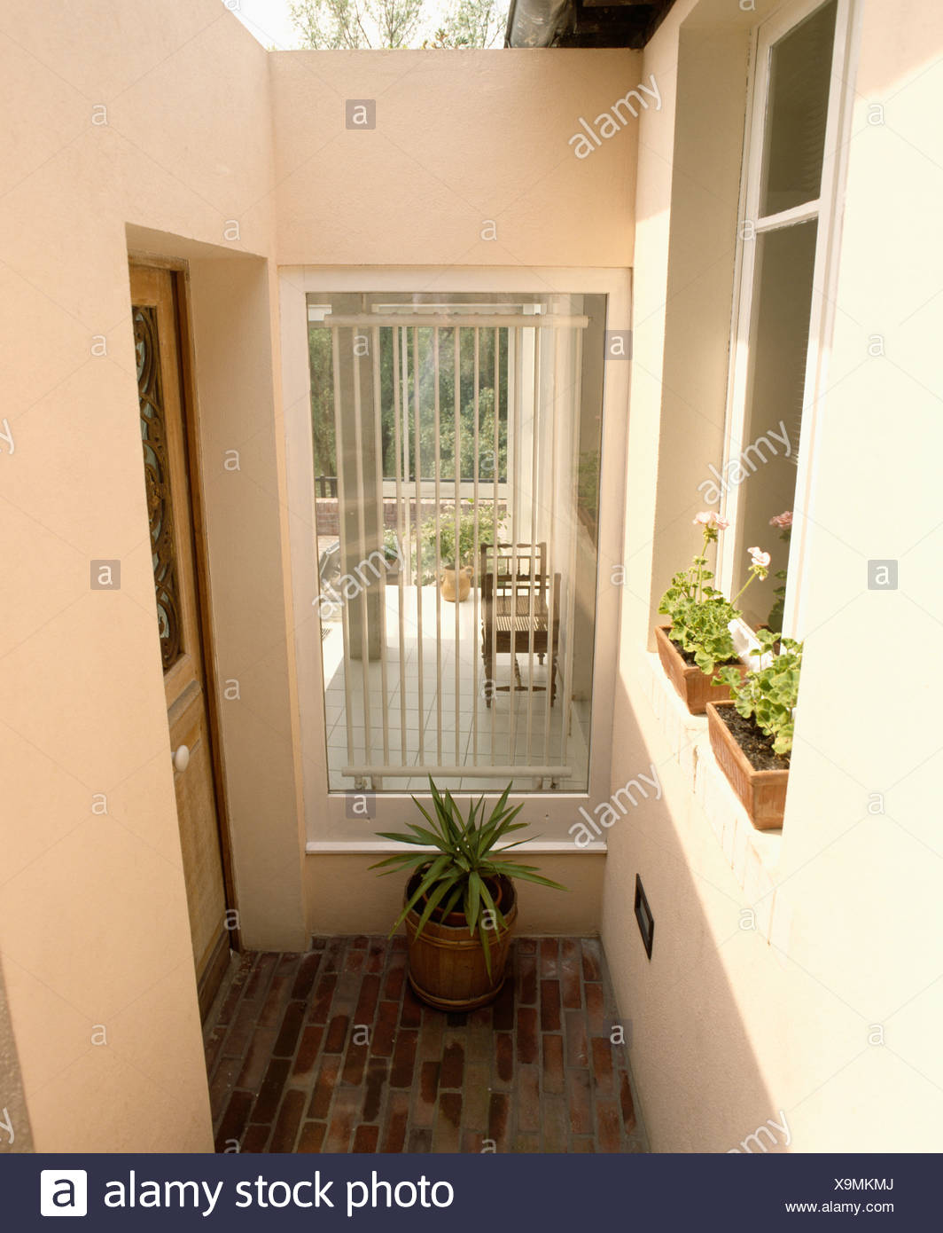 Small Porch Extension With Security Bars On Window With View