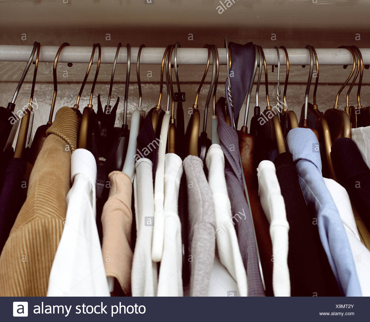 Clothes Hanging In Cupboard Stock Photos & Clothes Hanging In Cupboard