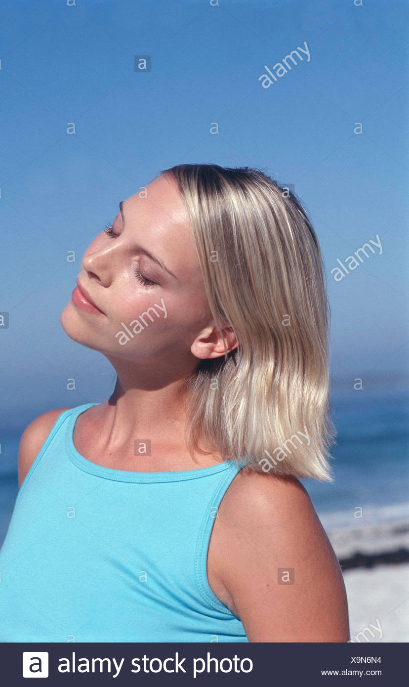 Semi Profile Of Tanned Female Chin Length Blonde Hair Wearing