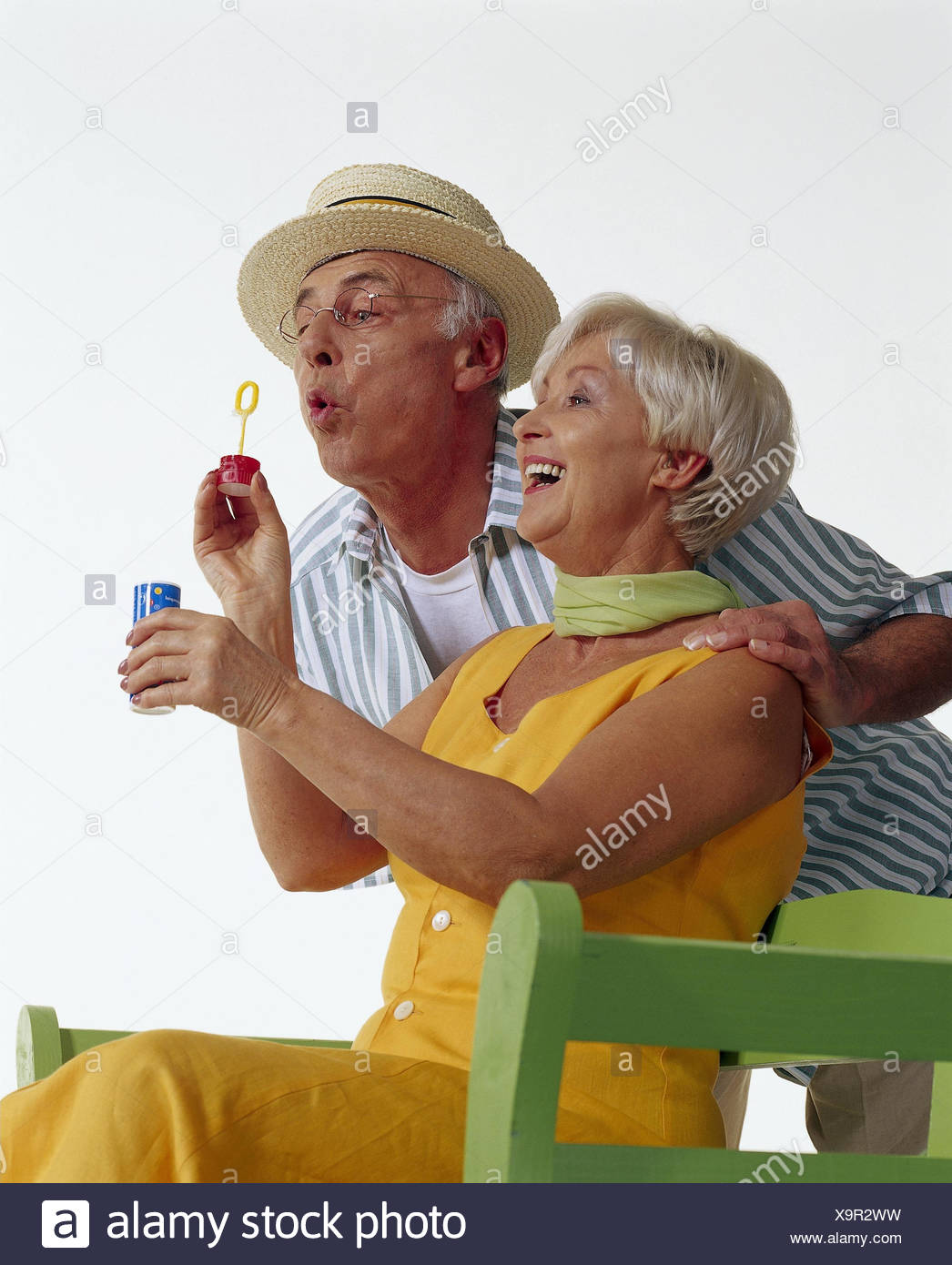 Senior Couple Park Bench Soap Bubbles Game Fun Summer Senior