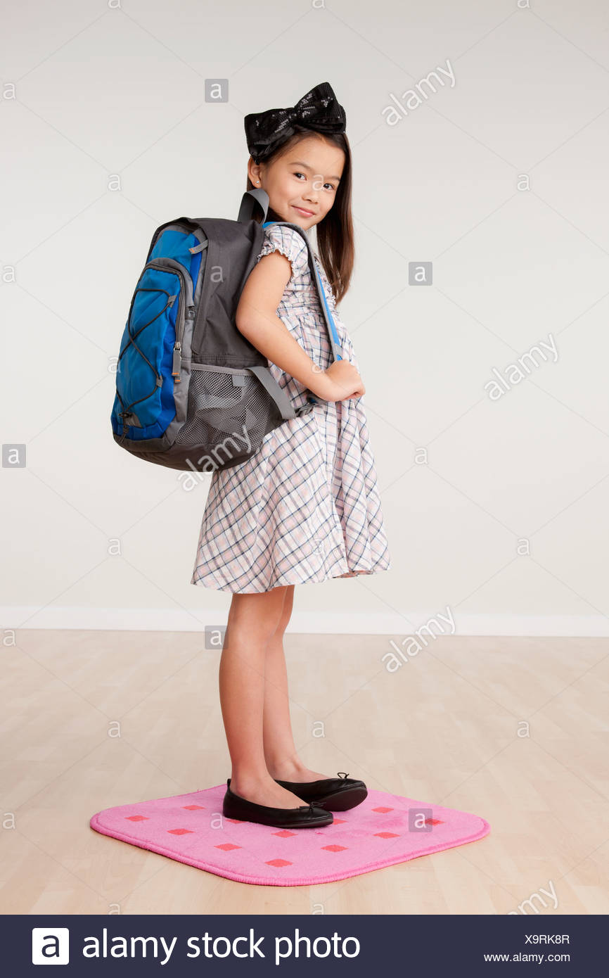 girl carrying backpack