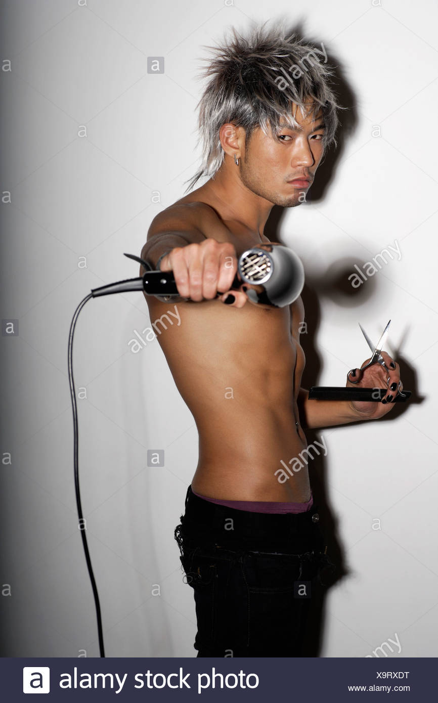 Young Man With Silver Hair Holding Silver Hair Dryer And Scissors