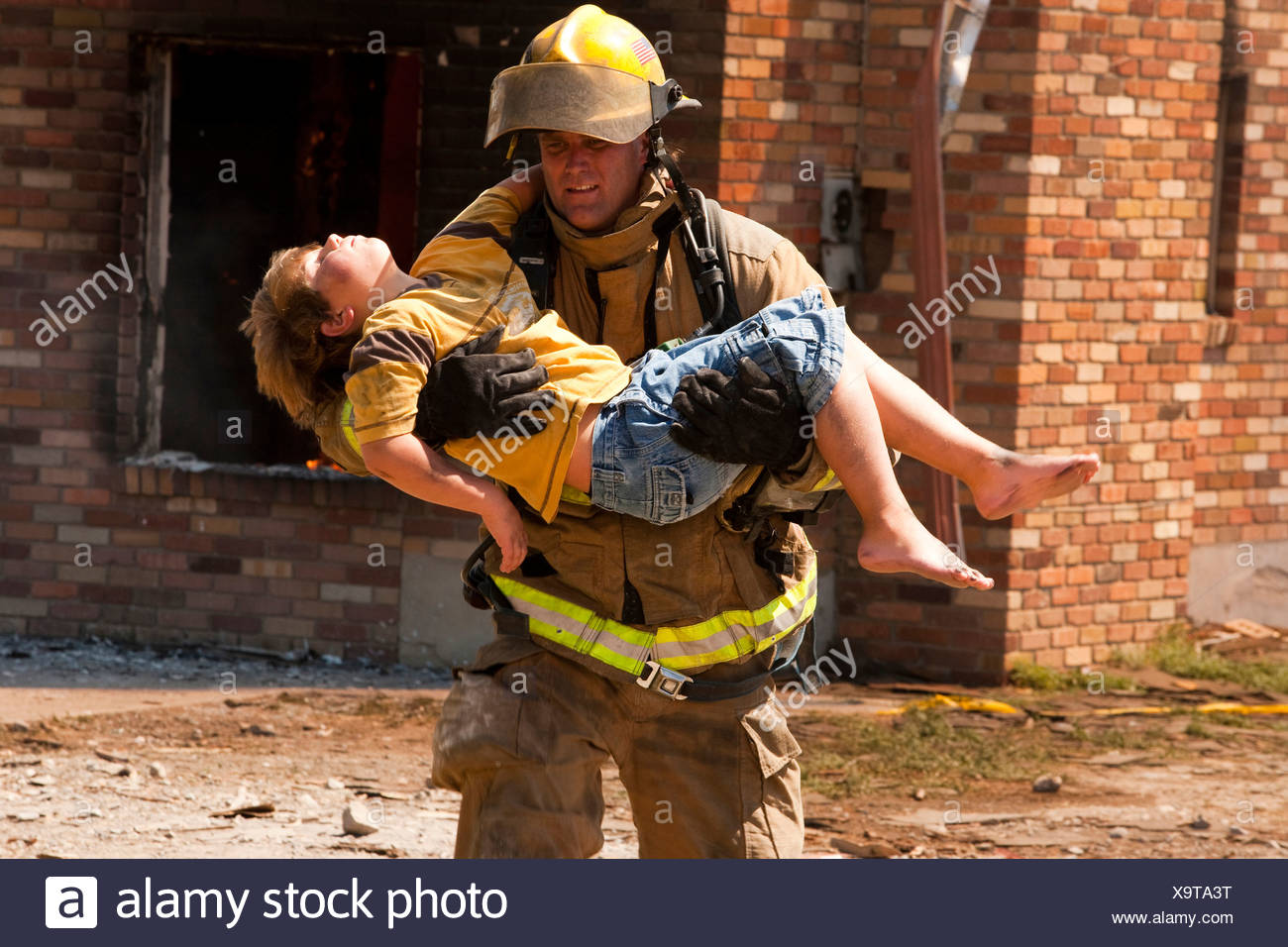 Firefighter Rescue Child Stock Photos & Firefighter Rescue Child Stock