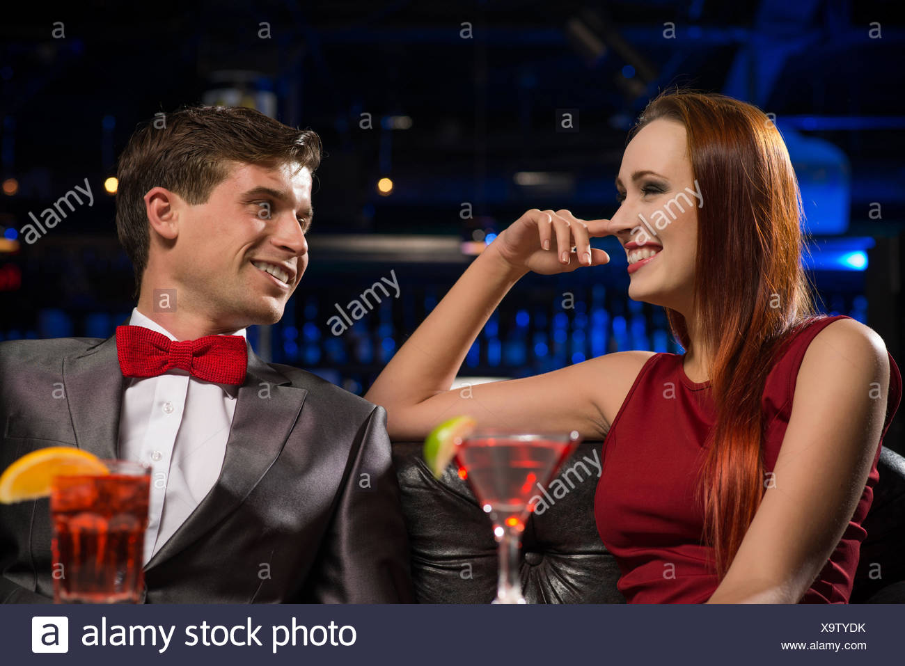 Image result for talking at a nightclub stock photos
