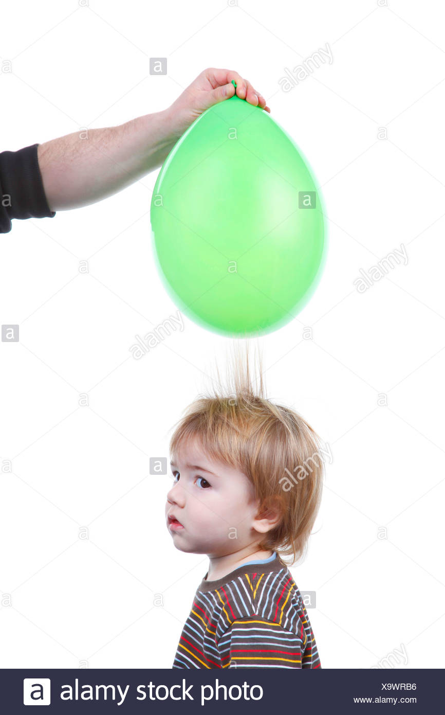 Little Boy S Hair Being Attracted By An Air Balloon Charged With