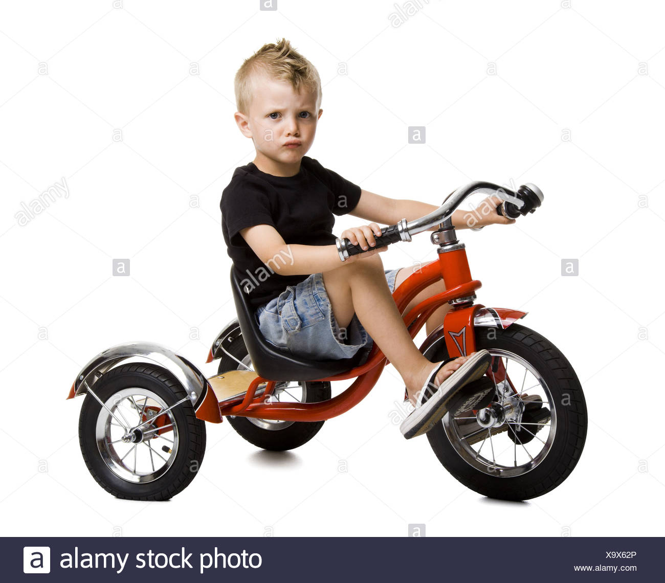 boy on tricycle