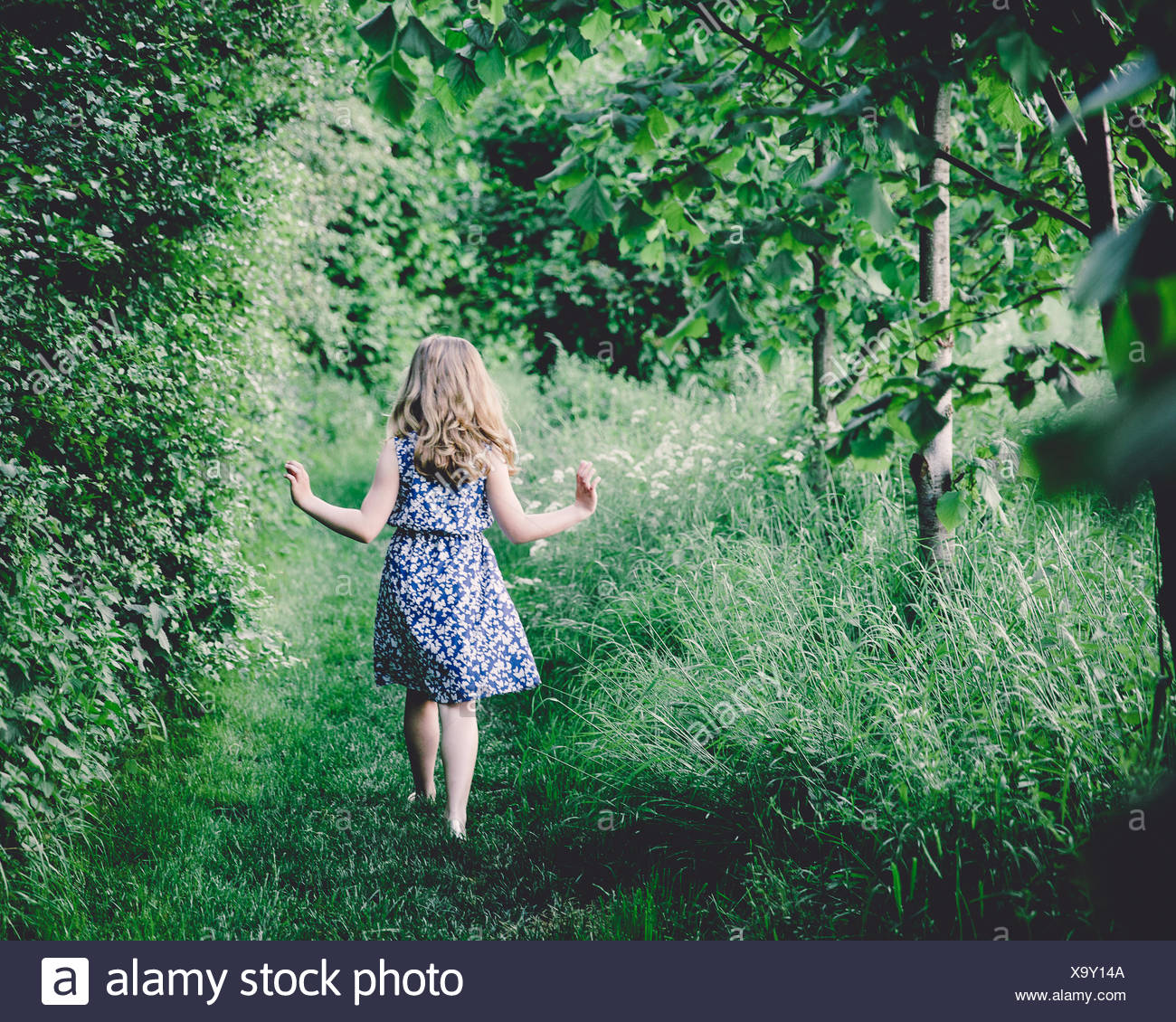 girl walking in woods
