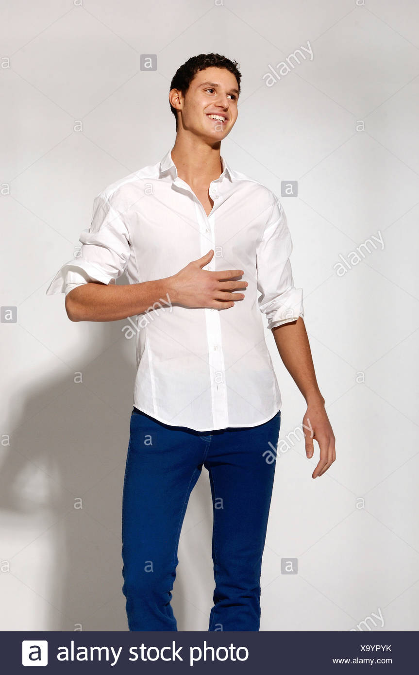 man in white shirt and blue jeans