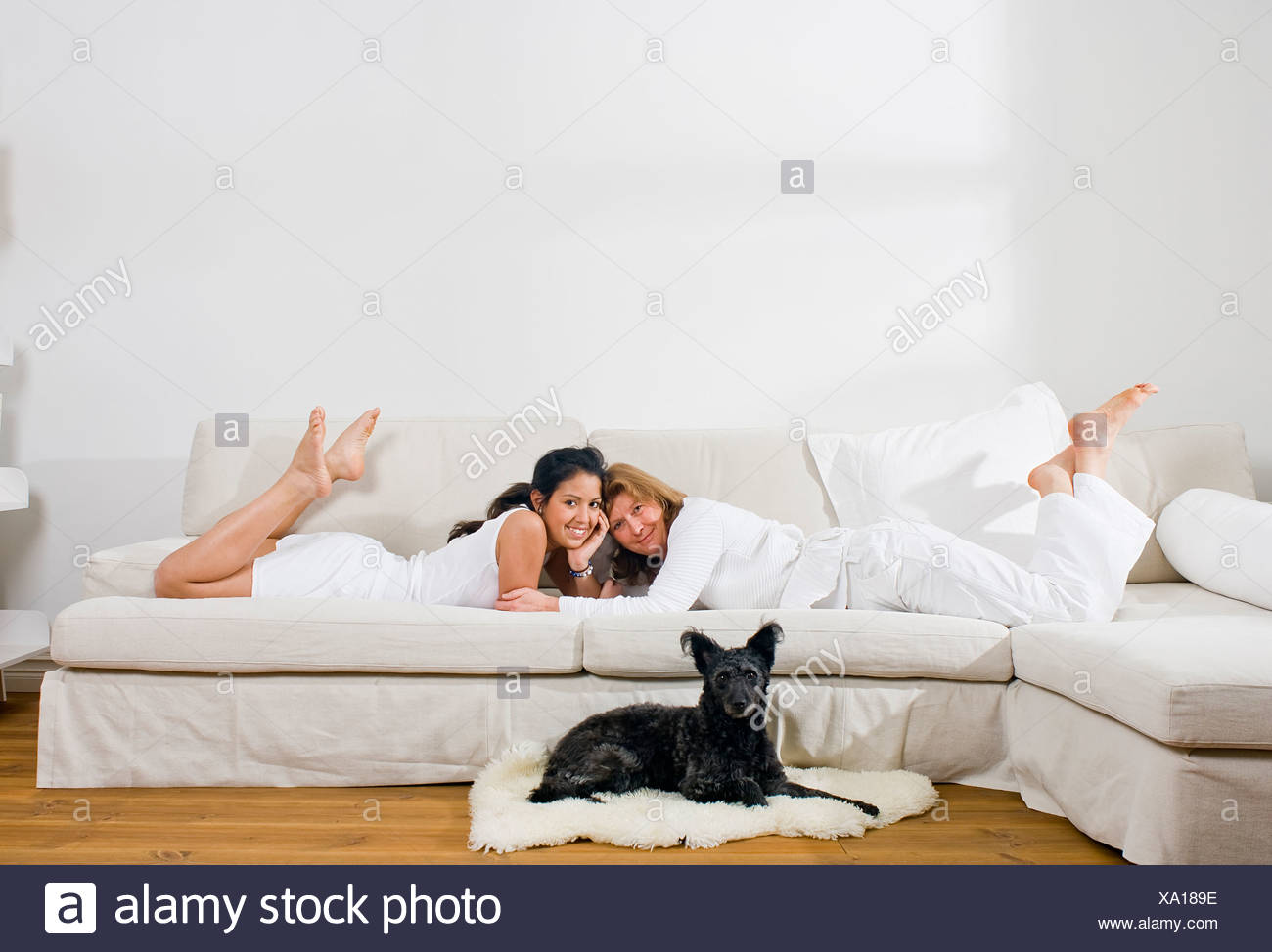 Barefoot Girl Lying On Couch High Resolution Stock Photography And Images Alamy