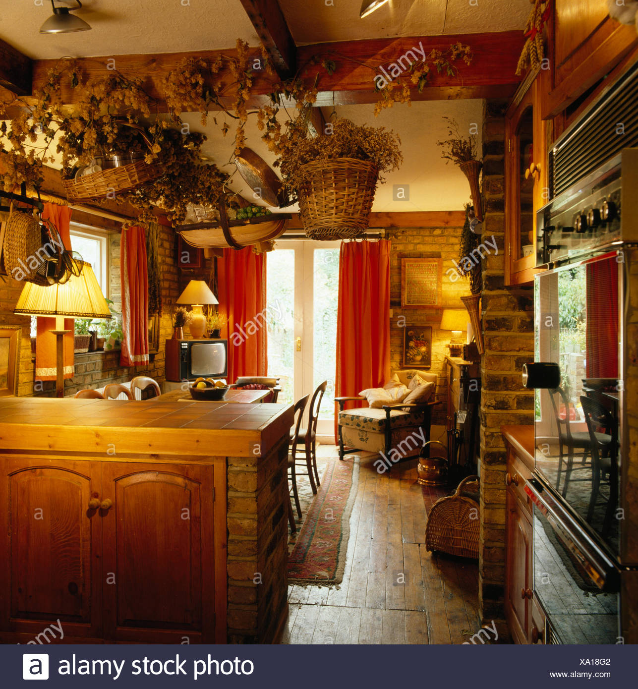 Baskets Of Dried Flowers Hanging From Ceiling In An Eighties