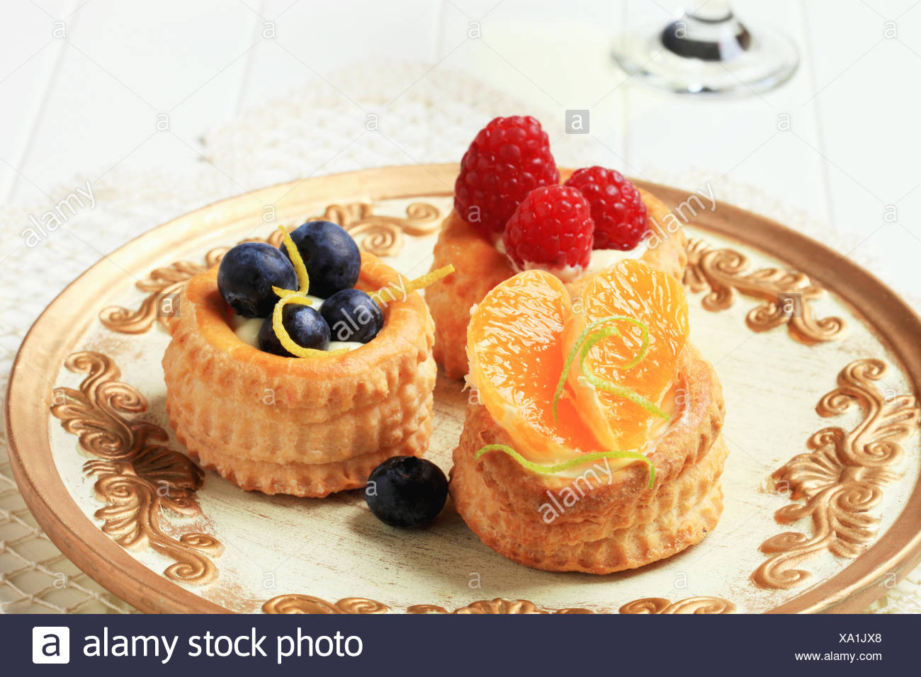 Custard Filled Puff Pastry Cases Topped With Fresh Fruit Stock Photo Alamy