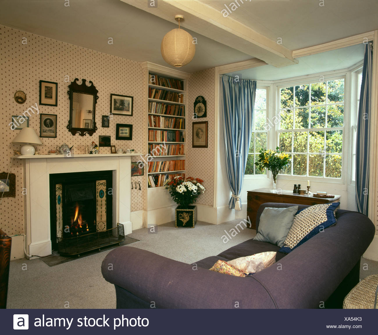 Country Livingroom With Fireplace And Ornaments Suspended From