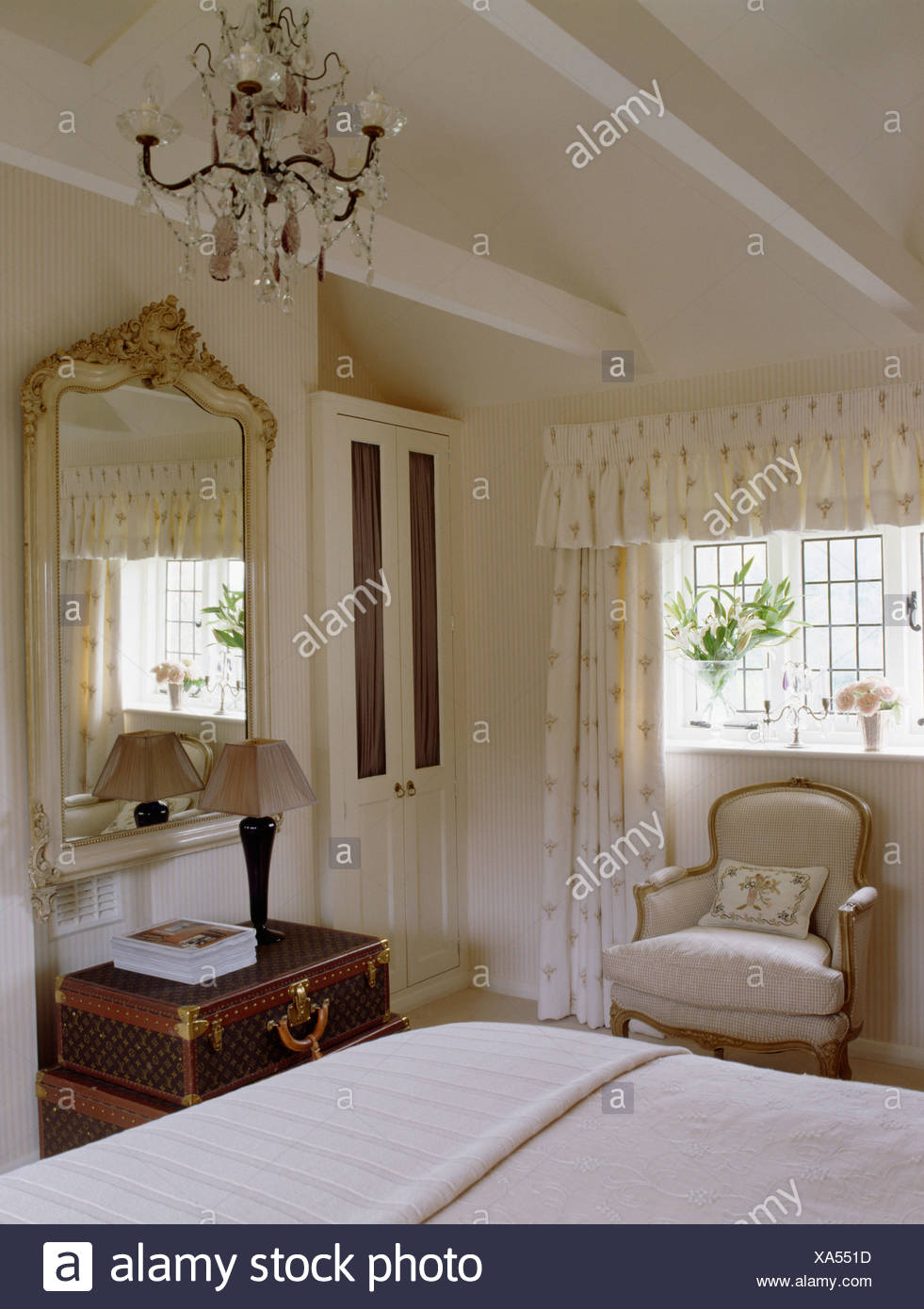 Chandelier And Apex Ceiling In Cream Country Bedroom With