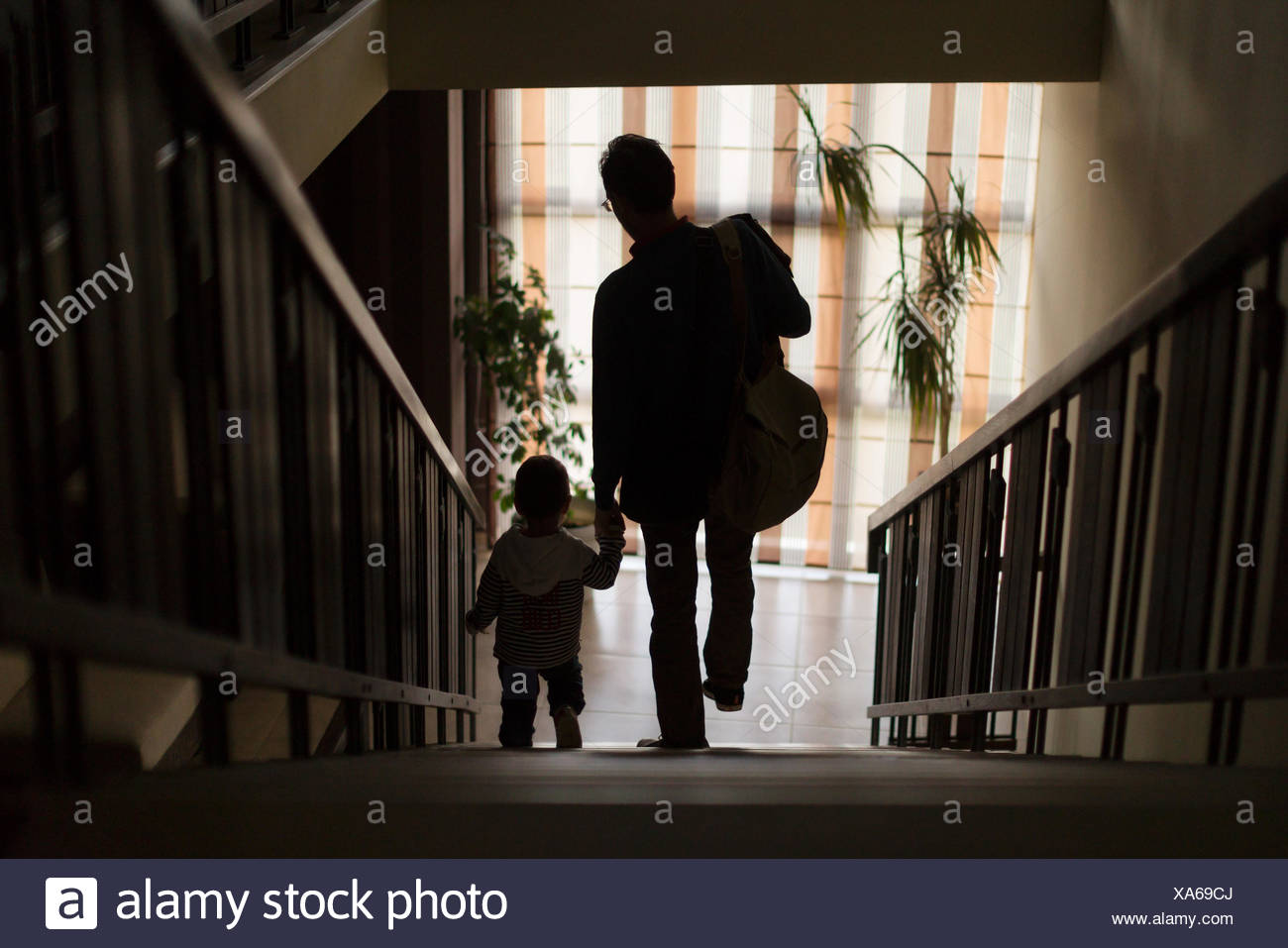 Man Walking Down Staircase High Resolution Stock Photography and Images