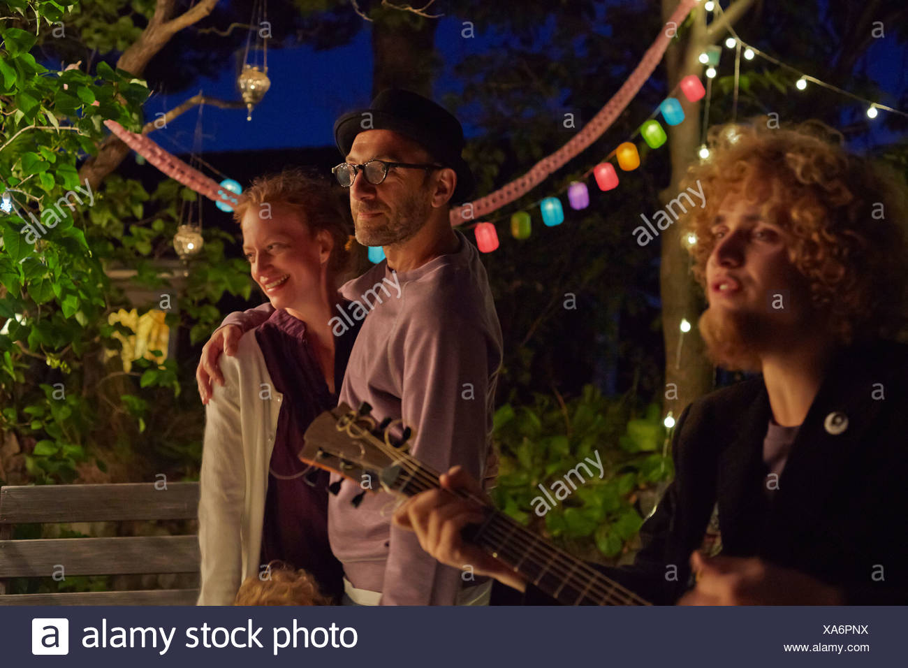 Couple Enjoying Garden Party At Night Stock Photo 281662022 Alamy
