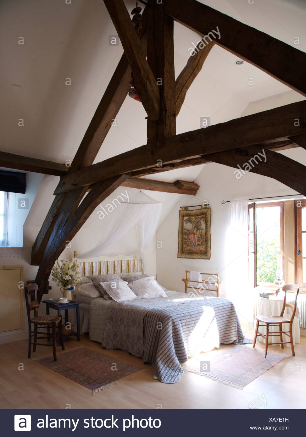 Rustic Wooden Beams On Apex Ceiling In French Country
